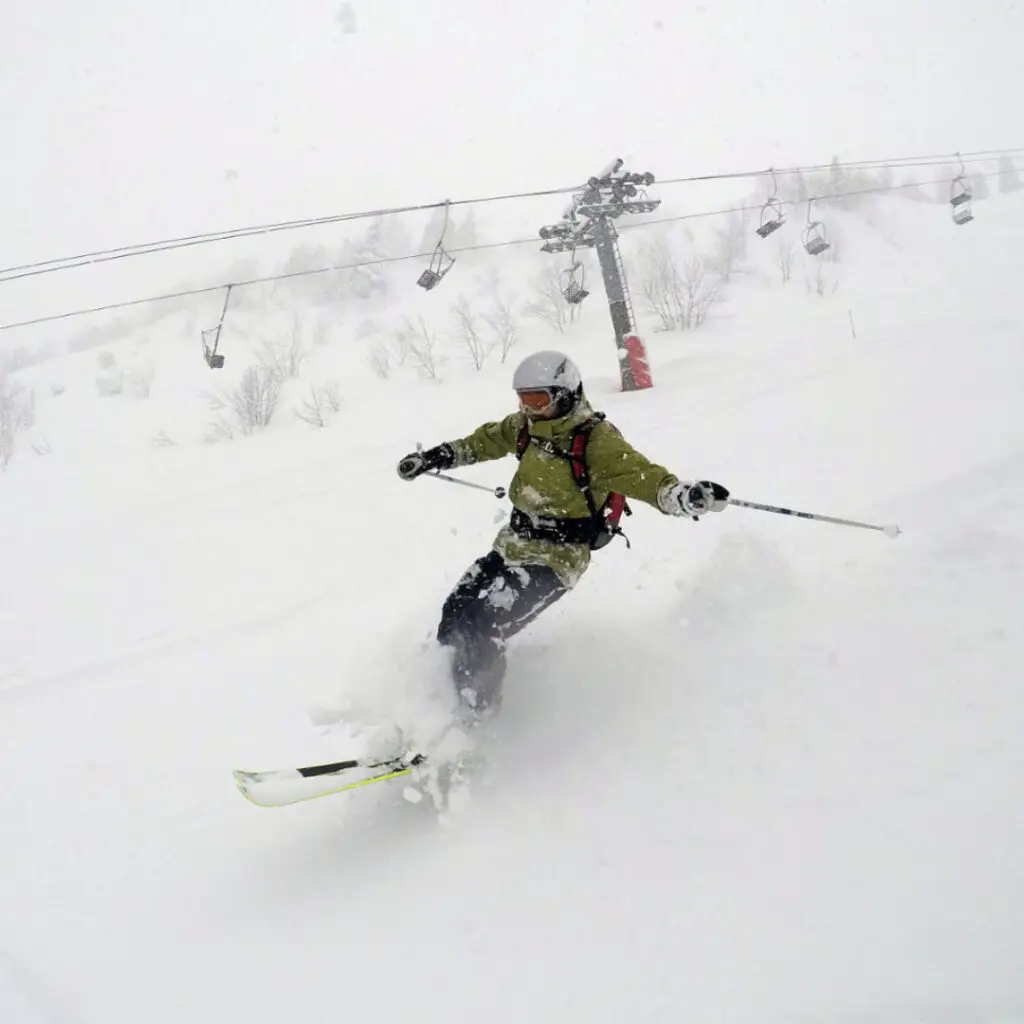 Skier enjoying fresh powder on Mont Chéry in Les Gets