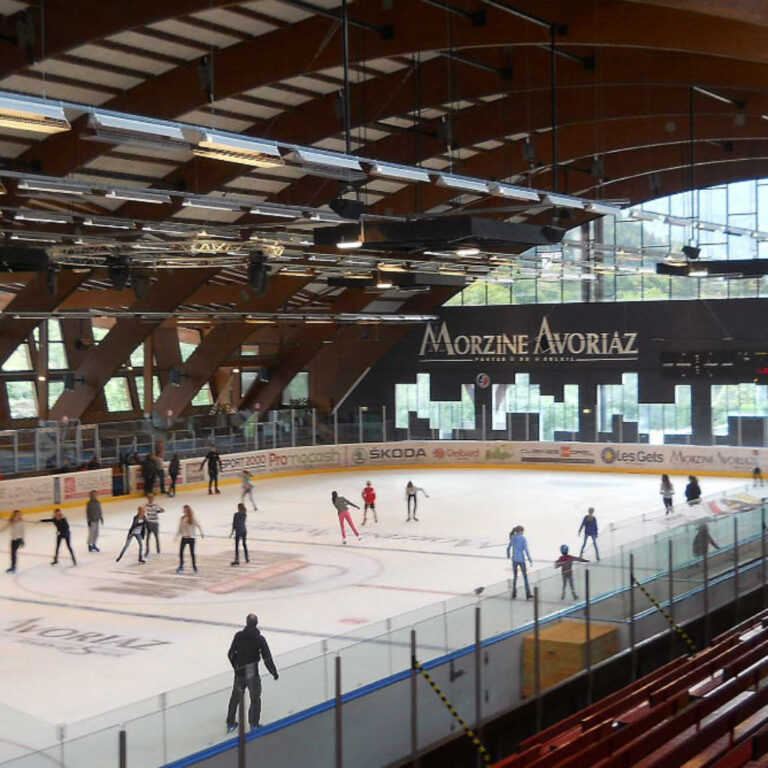 Indoor ice skating arena in Morzine, featuring skaters enjoying a winter activity.