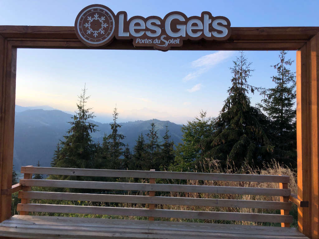 Summer in Les Gets, French Alps, with lush green landscapes, outdoor activities, and scenic mountain views.