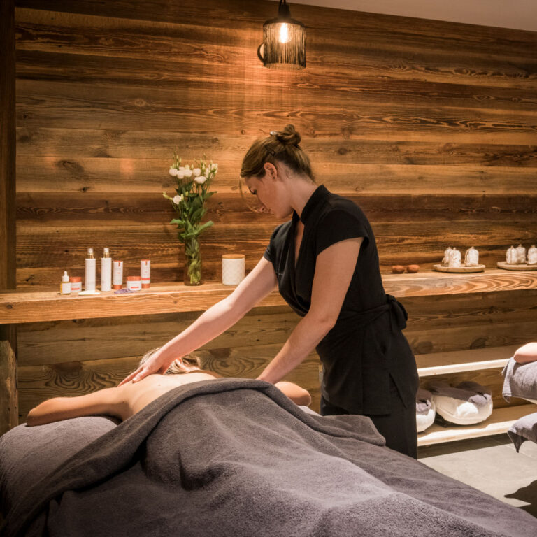 Person receiving a relaxing massage at a spa center in Les Gets.