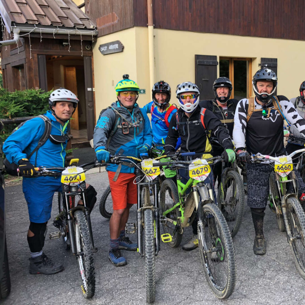 Group of men and women participating in the annual Passportes du Soleil mountain biking event, showcasing camaraderie and adventure.